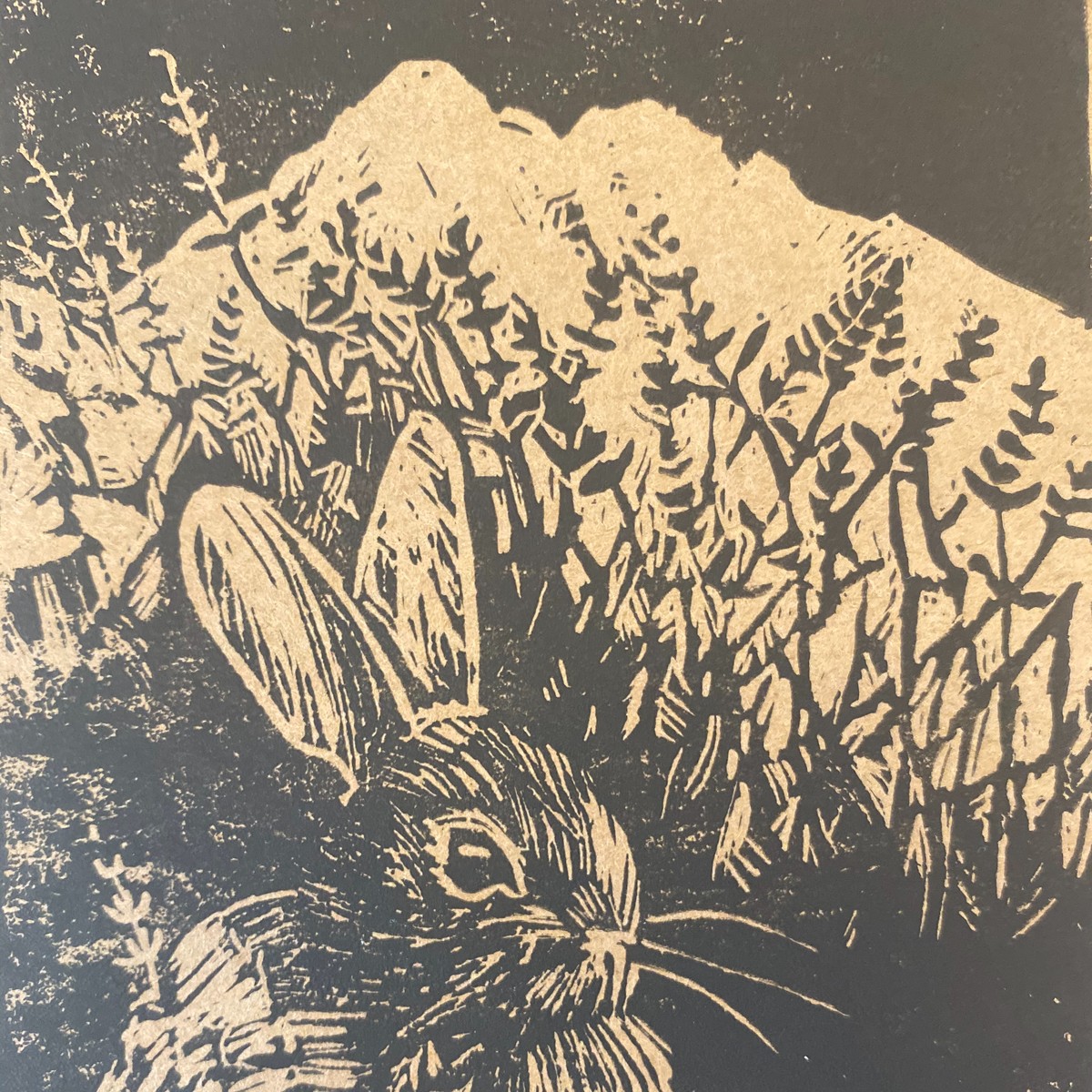Rabbit Mountain Lavender mark: a rabbit against the mountains among lavender